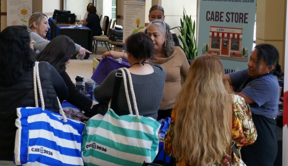 attendees with tote bags
